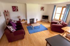 Living Room in Lochside Cottage 1 at Leckmelm Holiday Cottages near Ullapool